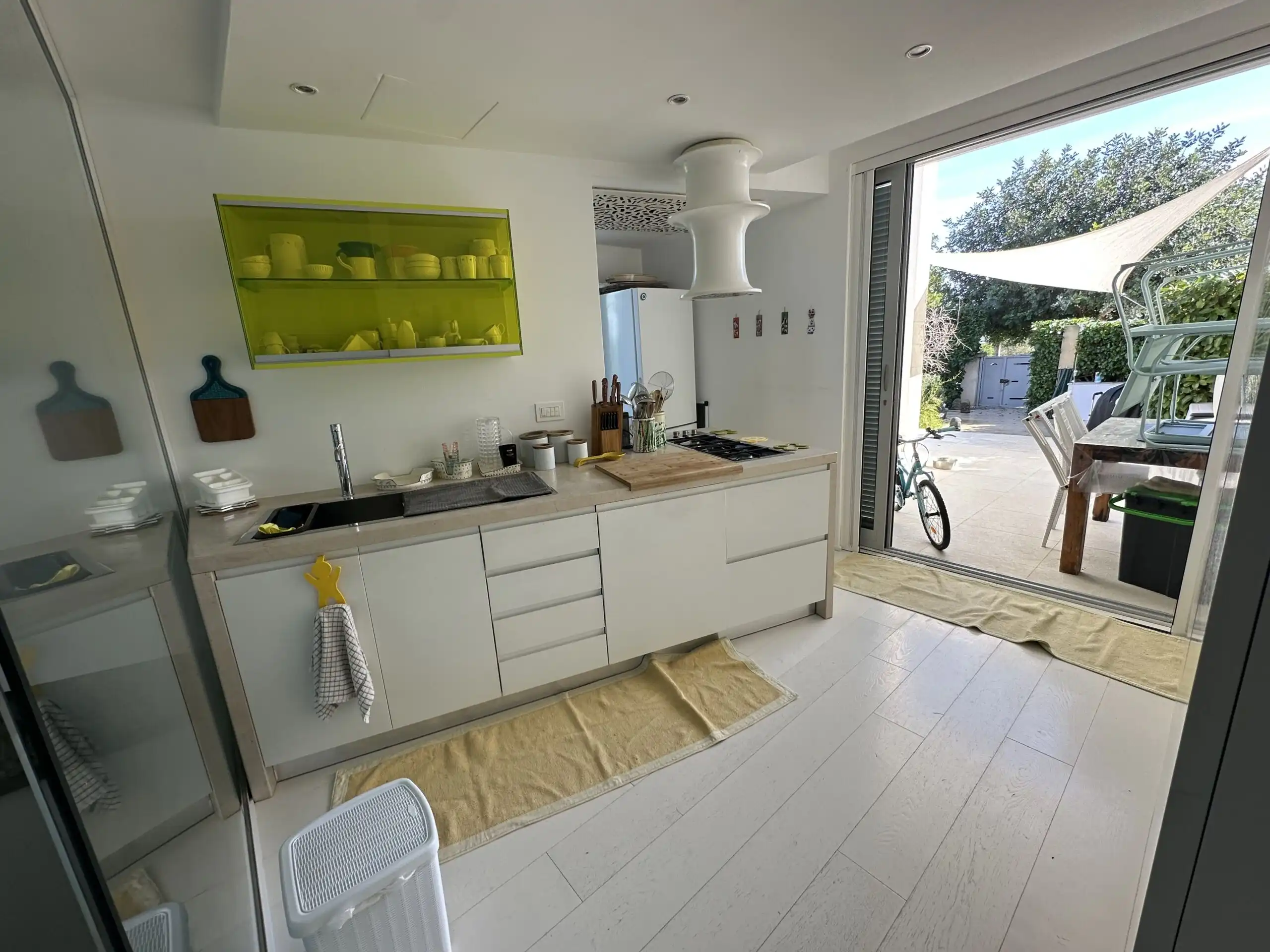 Bright, contemporary kitchen with outdoor access and natural light.