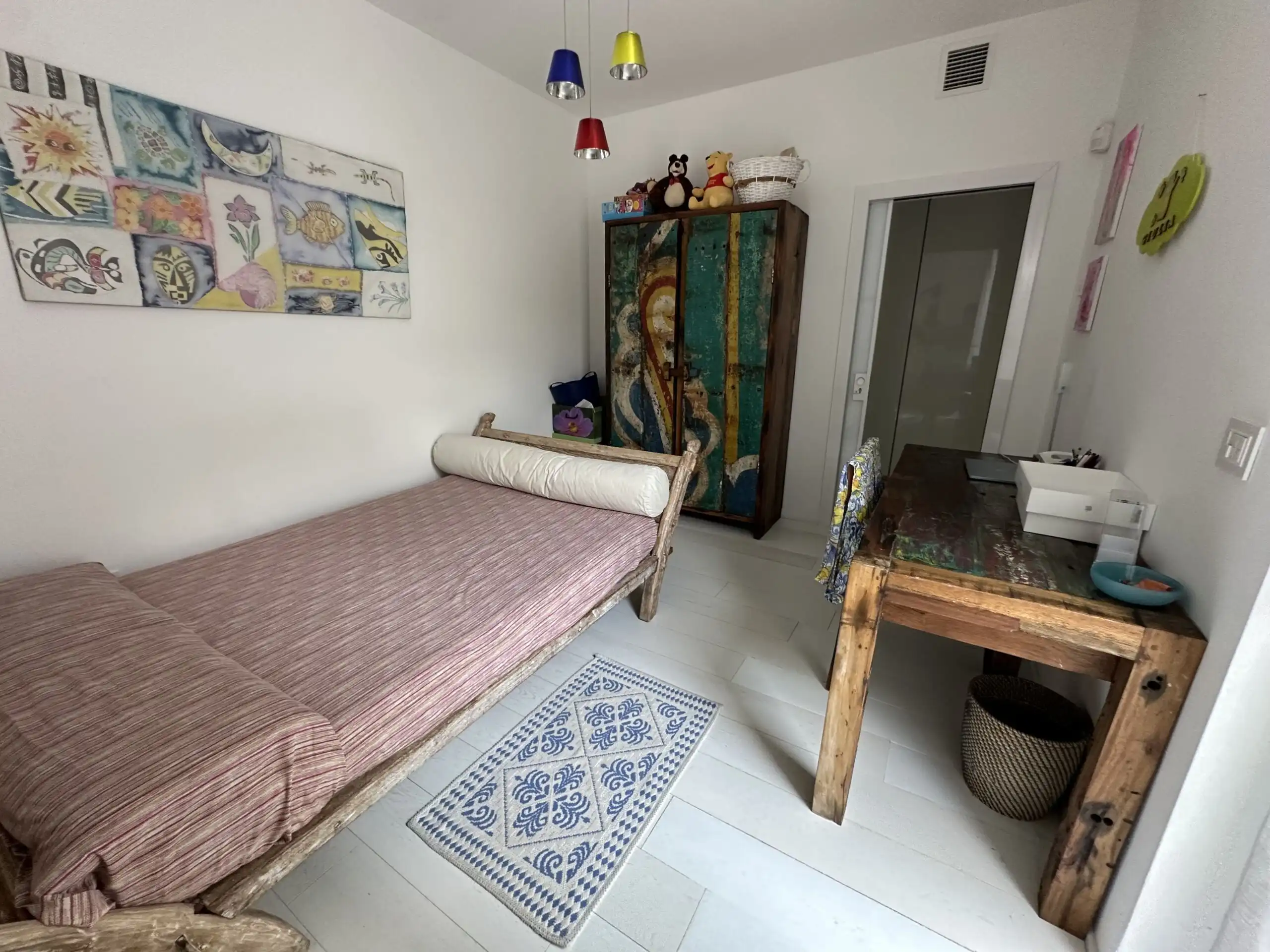 Villa interior with cozy bedroom and colorful decor in Otranto, Puglia, near the Adriatic Sea.