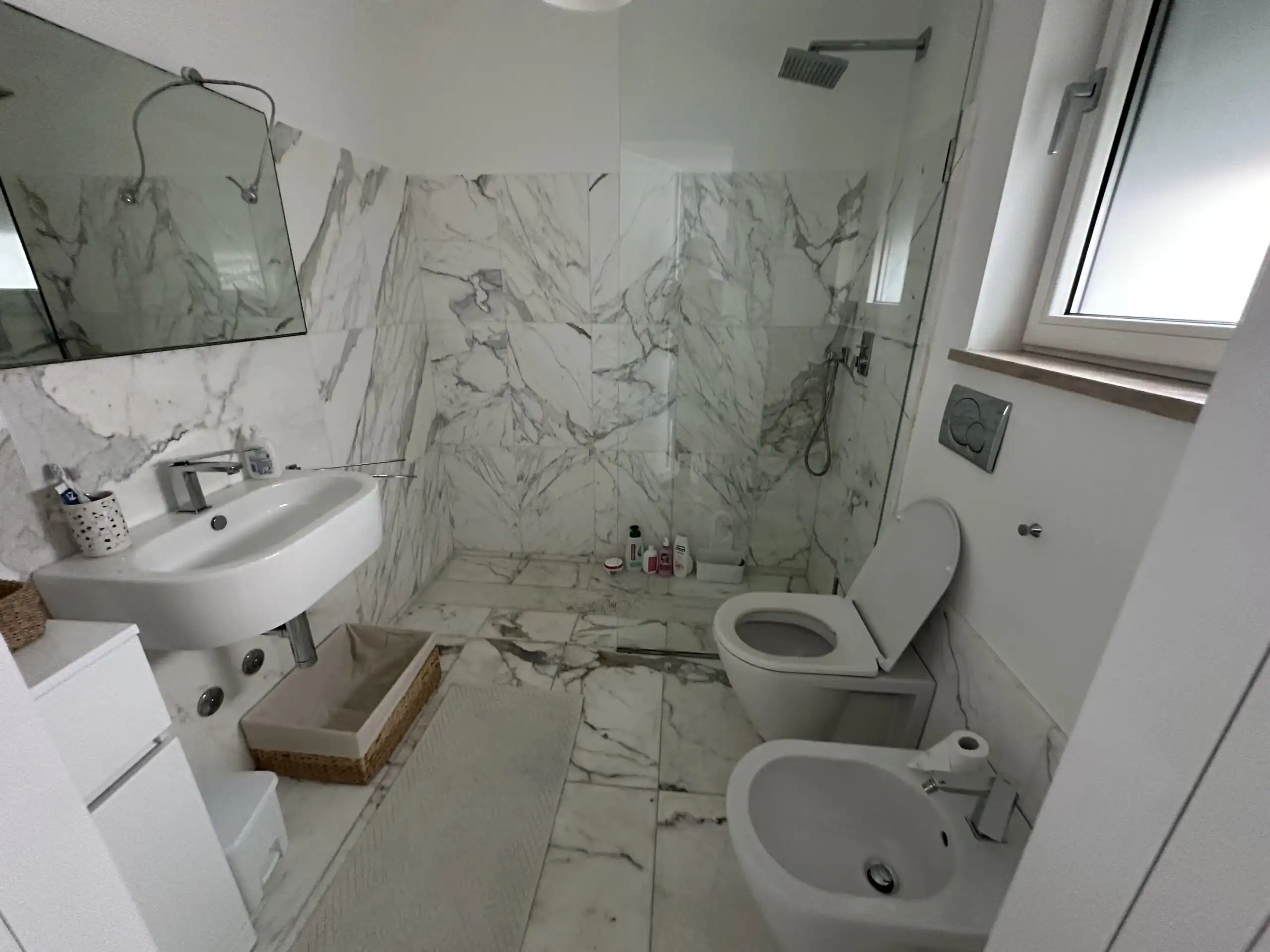 Panoramic villa bathroom with marble finishes near Otranto, Puglia, 700m from the Adriatic Sea.