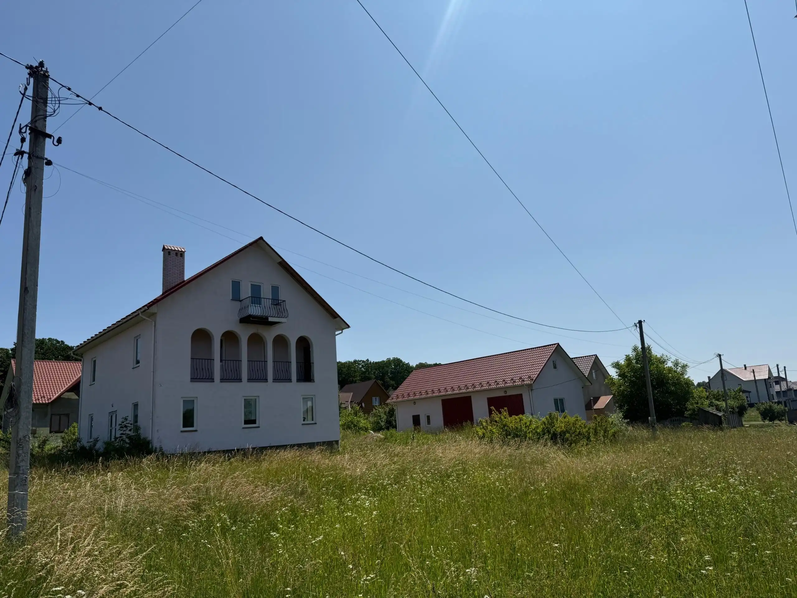 Duplex house for sale in Storozhynets, Ukraine, with scenic nature views and ample outdoor space.