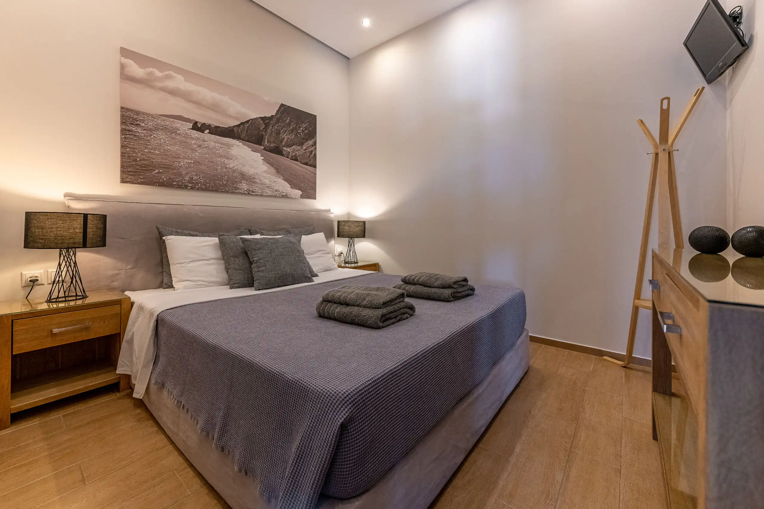 View villa bedroom with modern decor and cozy ambiance in Skiathos, Greece. Perfect for relaxing sta.