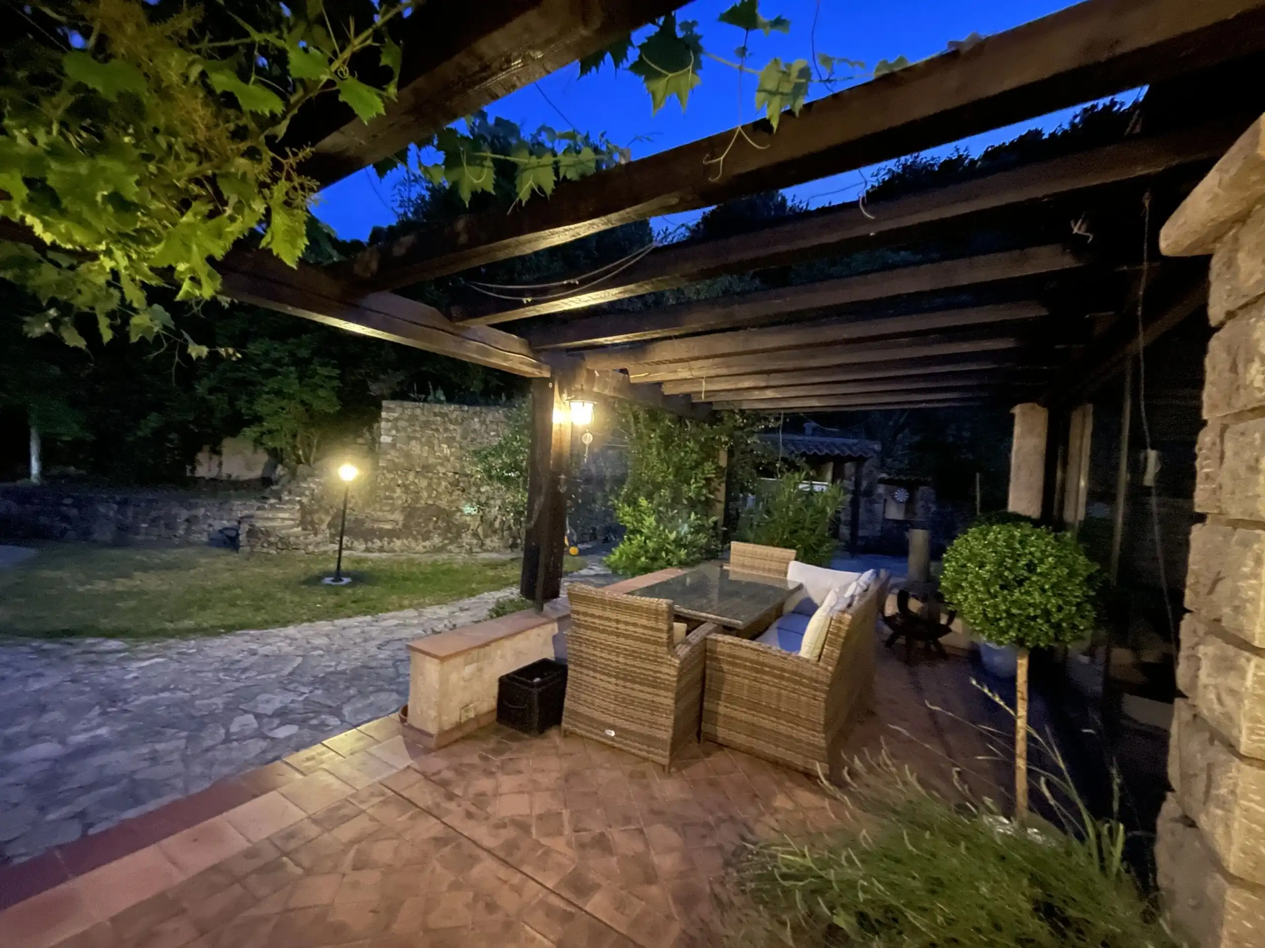 Elegant outdoor lounge with pool and gardens in Biot, French Riviera.