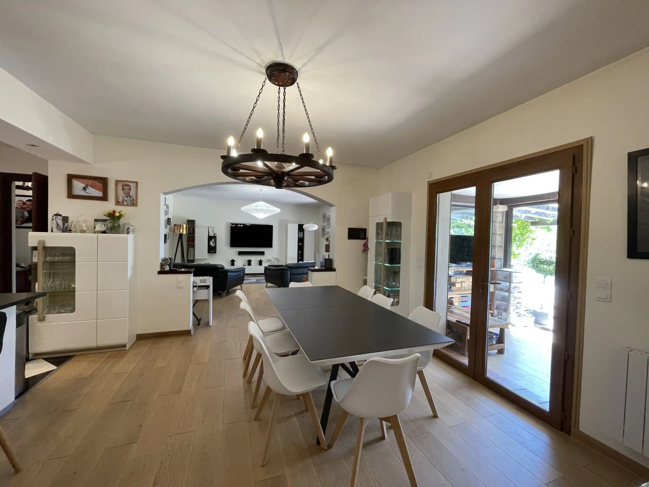 Spacious dining area with modern decor, large windows, and access to outdoor gardens in a beautifull.