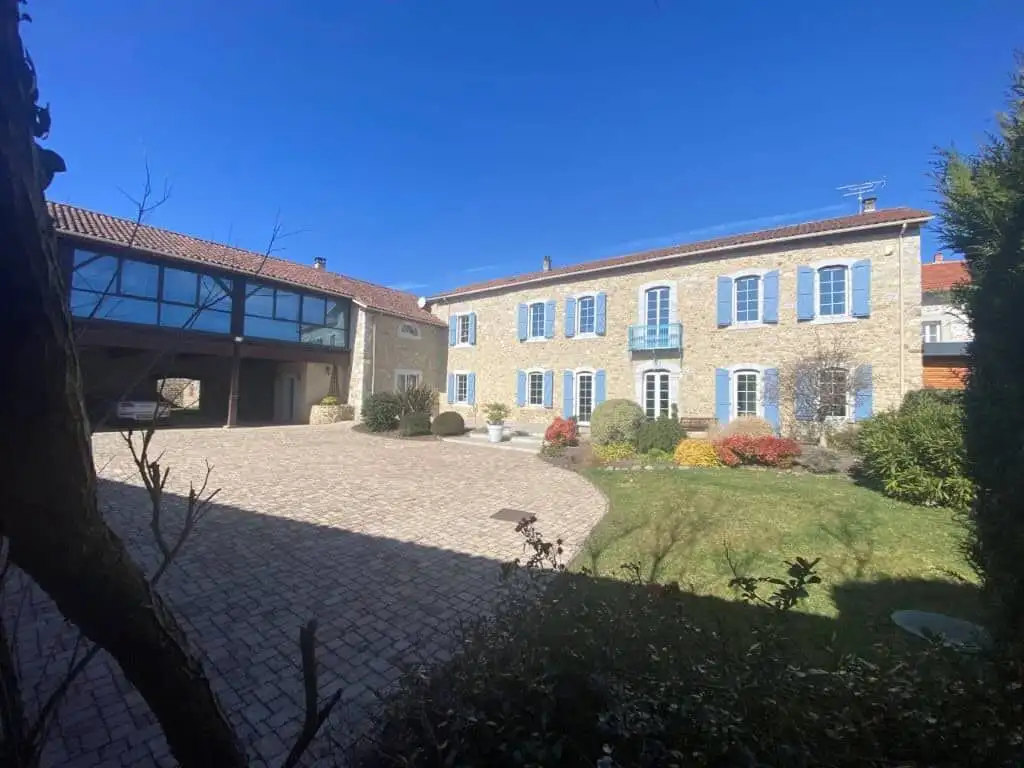 Built bed and breakfast for sale in Ausson, Haute Garonne, with beautiful gardens and modern ameniti.
