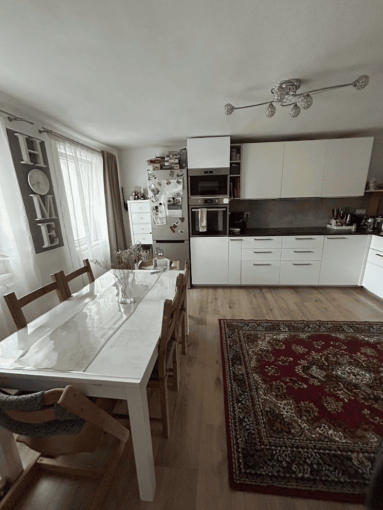 Building with 4 Apartments For Sale in Wilhelmsburg Apartment interior with modern kitchen and dining area in Wilhelmsburg.