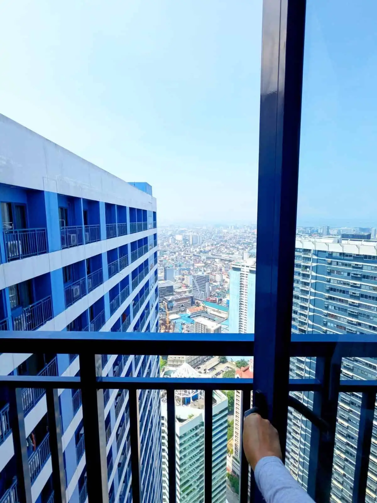 City skyline view from a 1-bedroom apartment in Manila.
