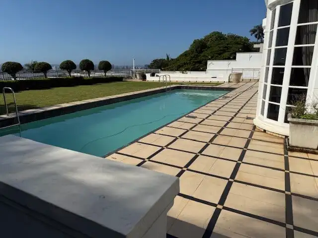 Pool area of a luxury 5-bedroom villa in Morning Side, Durban, with a scenic ocean view.