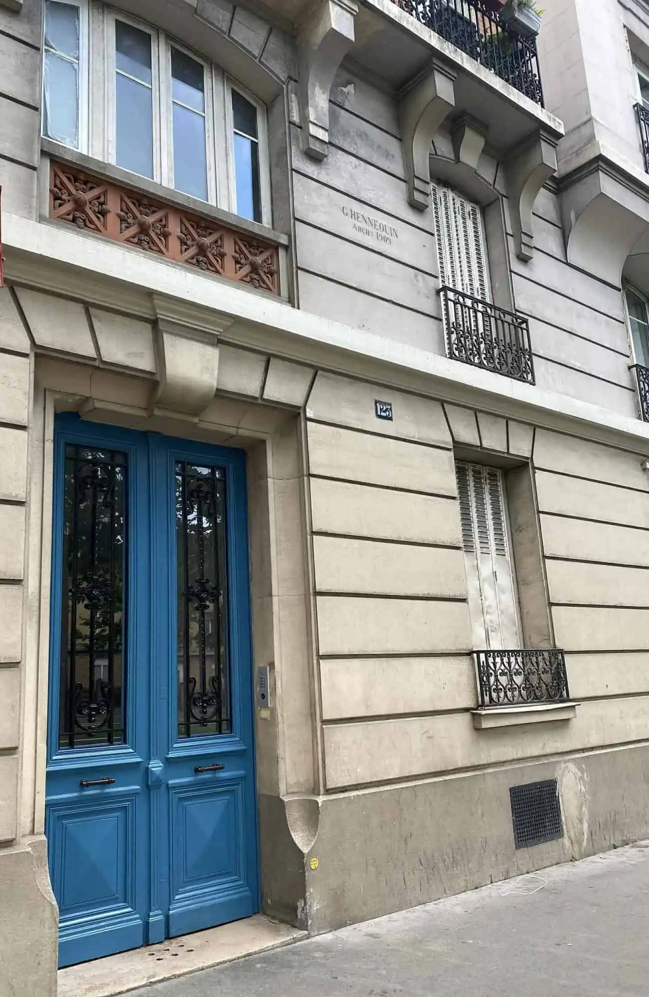 Apartment with blue door and classic Parisian architecture.