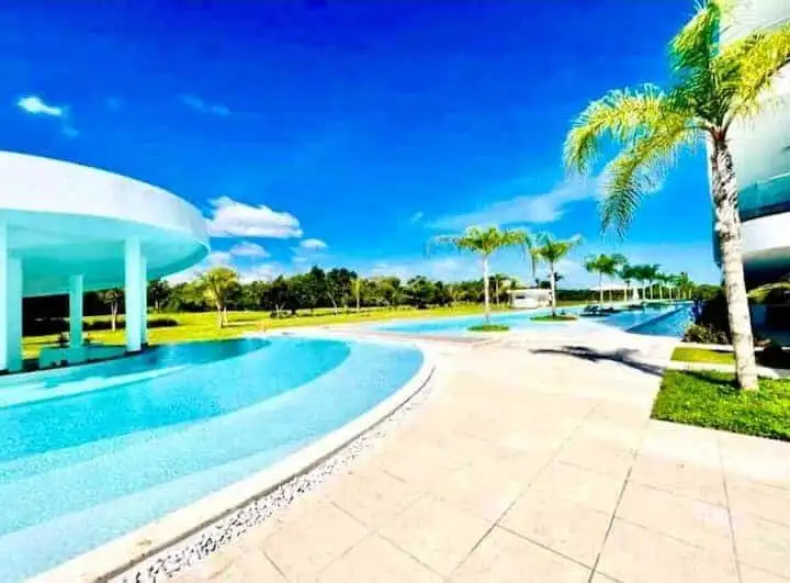 Pool and palm trees at Cana Rock STAR Punta Cana.
