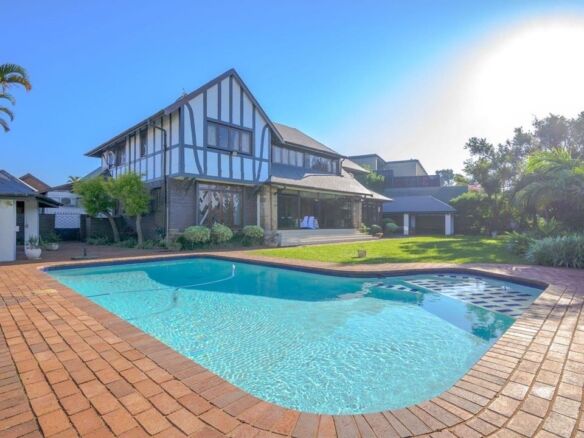 Elegant 9-bedroom estate in Durban featuring a private pool and lush gardens. Perfect for luxury liv.