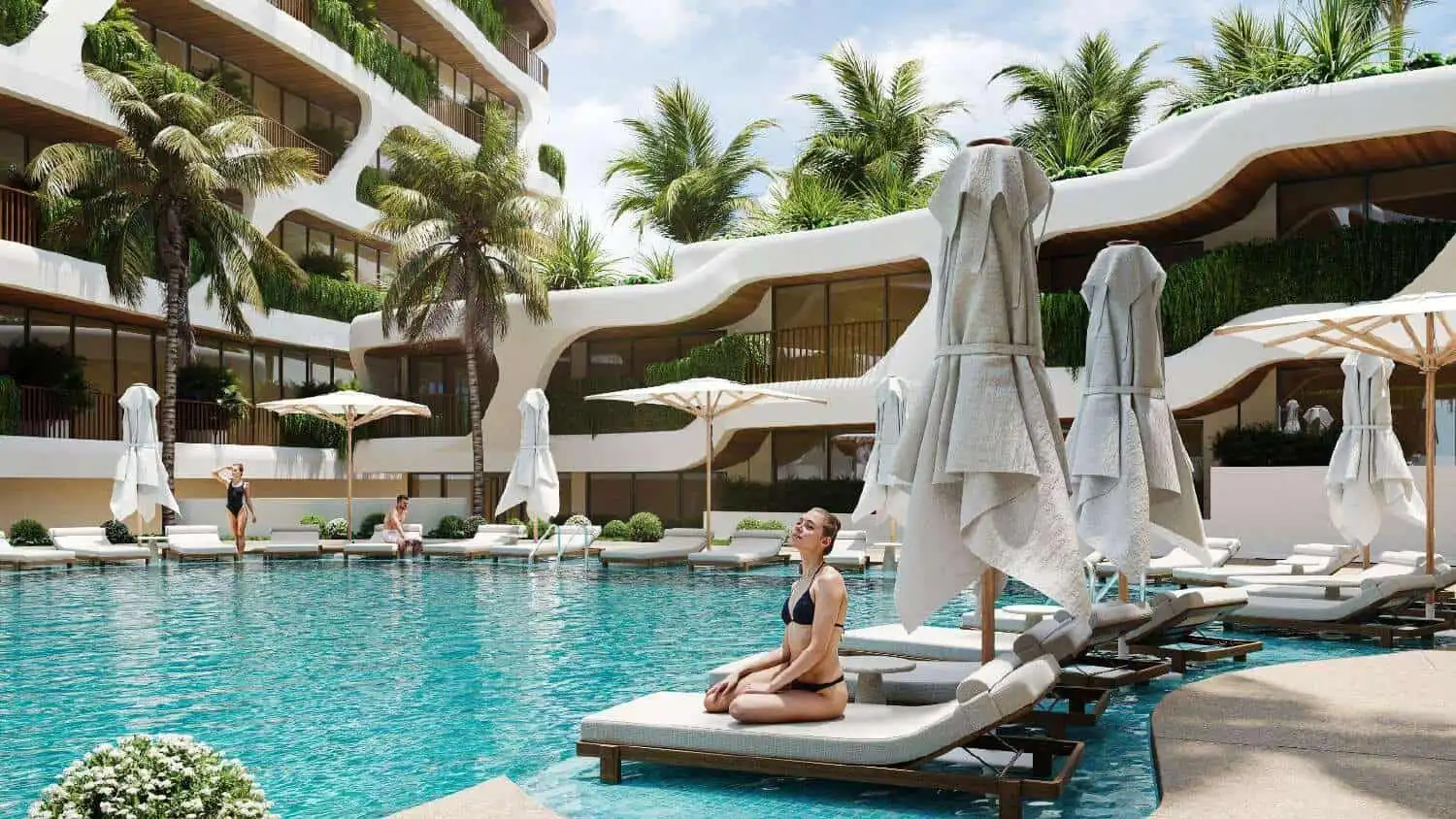 Beautiful pool area at Pandawa Dream Complex Bali with sun loungers and umbrellas. Perfect for relax.