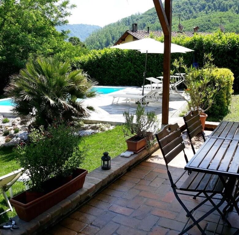 Beautiful outdoor patio with pool and garden in Bagni di Lucca, Italy.