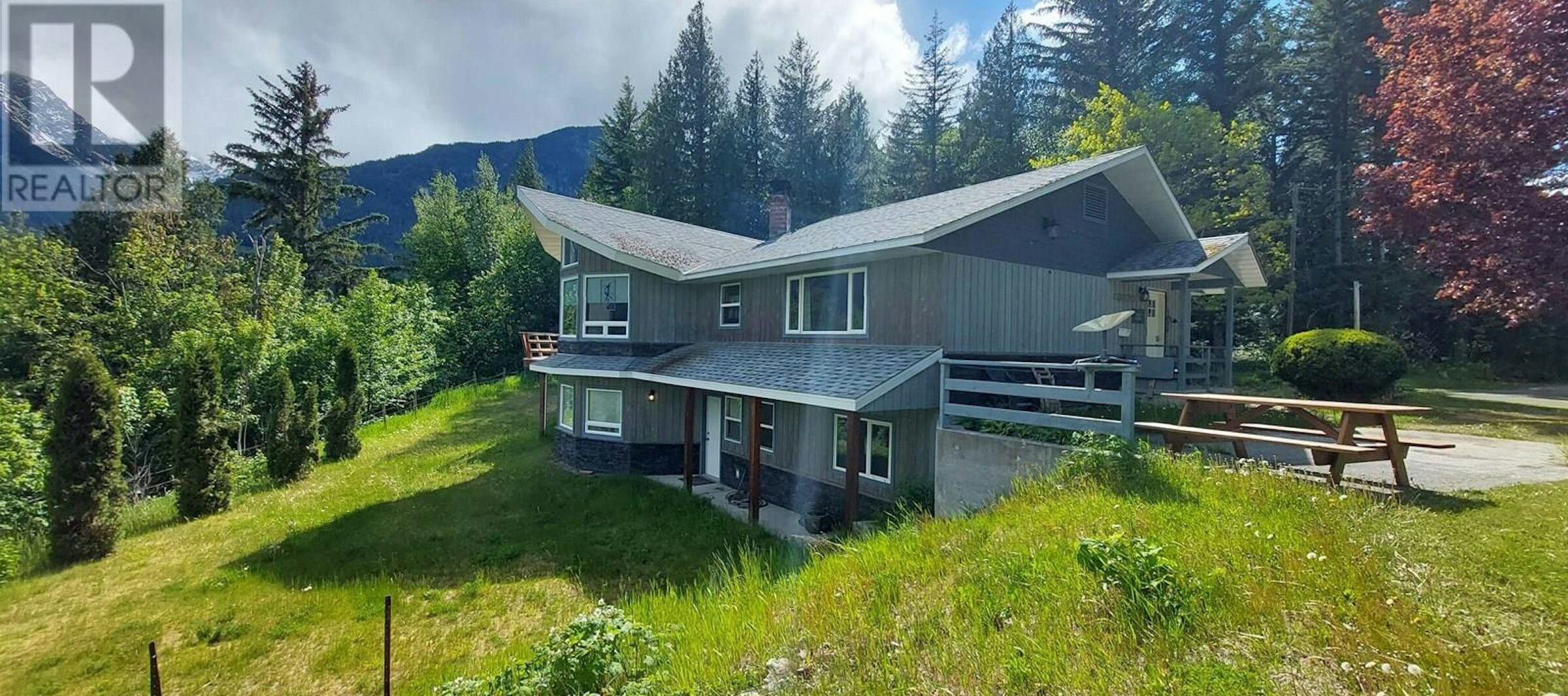 Charming 4-Bedroom Estate in Bella Coola BC Beautiful 4-bedroom estate for sale in Bella Coola, British Columbia, surrounded by lush greenery an.