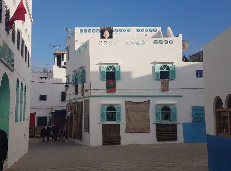 Beautiful white apartment for sale in Asilah South Tanger, featuring traditional architecture and vi.