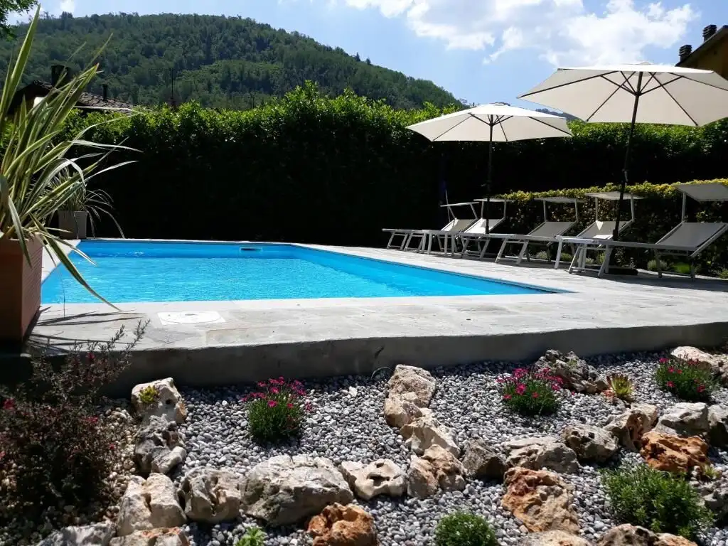Elegant private pool with mountain views in Bagni di Lucca. Perfect for relaxing holidays in a sceni.
