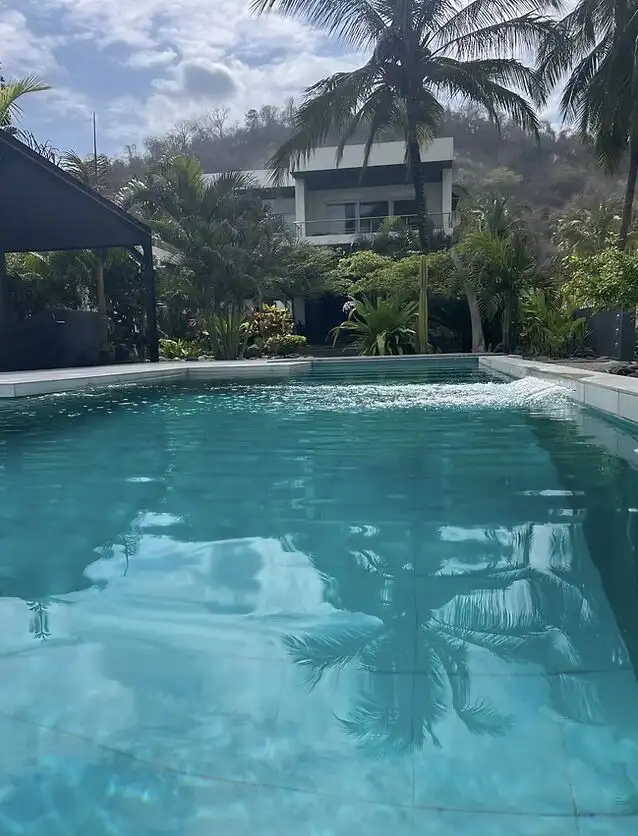 Modern luxury villa with pool, tropical garden, and ocean views in El Matal, Manabí.