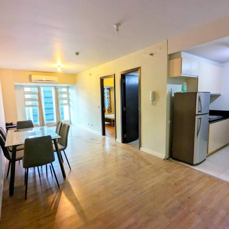 Bright, spacious 1-bedroom apartment in Kroma Tower Manila with open-plan living area.