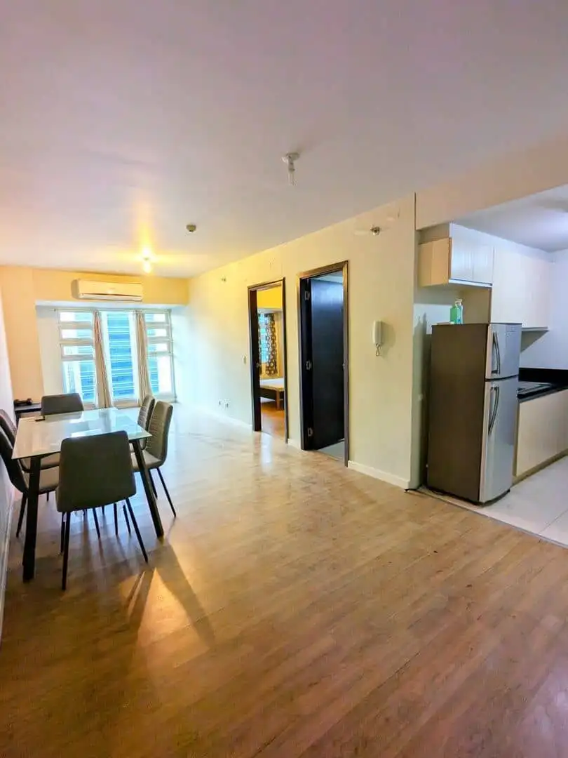 Bright, spacious 1-bedroom apartment in Kroma Tower Manila with open-plan living area.