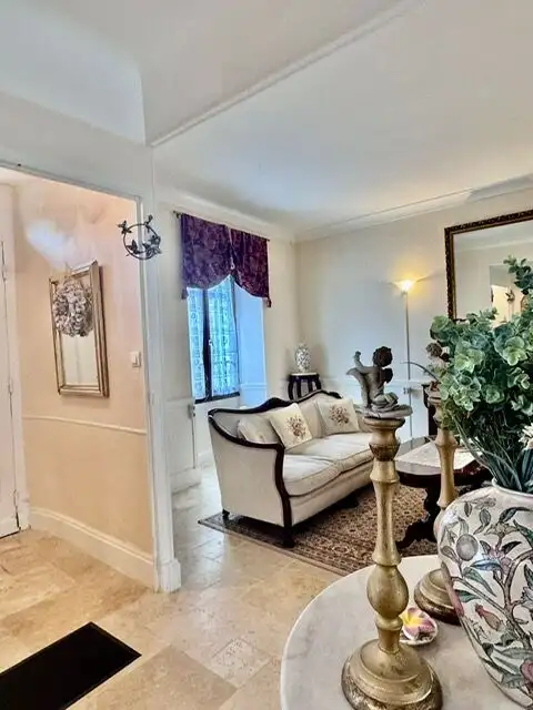 Elegant living room with classic furniture and decorative accents.