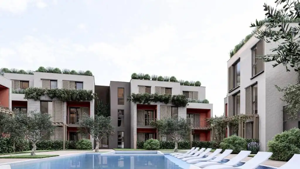 Modern Palm City Residencies Apartments in Kotor Contemporary apartments at Palm City Residencies in Kotor with lush greenery and scenic views.