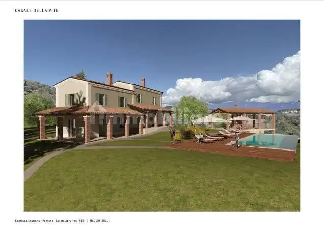 Modern apartment complex with pool and outdoor lounging area in Tortuga Beach Resort.