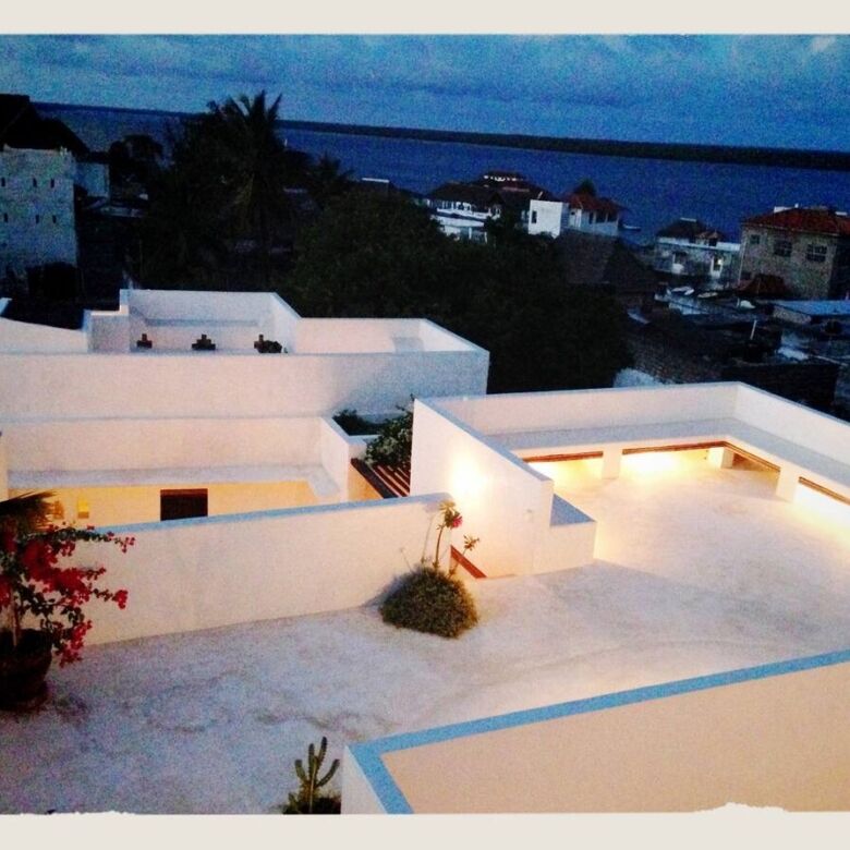 Modern rooftop terrace with ocean views in Lamu Town.