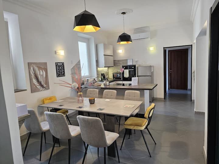 Bright, modern 3-bedroom apartment in Frascati, Rome with stylish decor and open-plan living area.