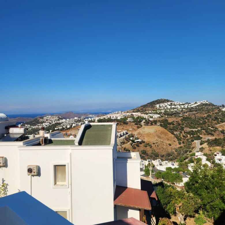 Sea view luxury 3-bedroom villa in Gumusluk, Bodrum, offering stunning vistas and modern amenities.