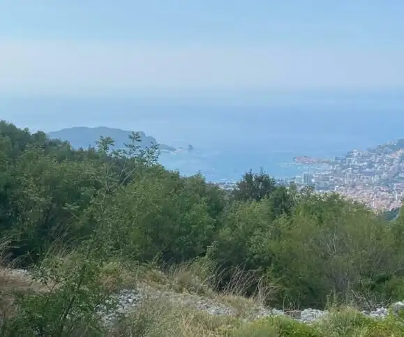 Beautiful land for sale in Budva, Montenegro, offering panoramic views of the Adriatic coast and lus.