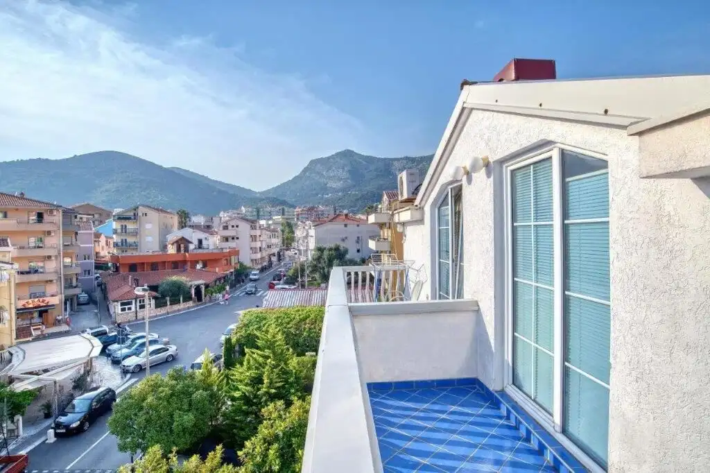 Boutique hotel for sale in Budva with scenic mountain views and modern amenities. Prime investment o.