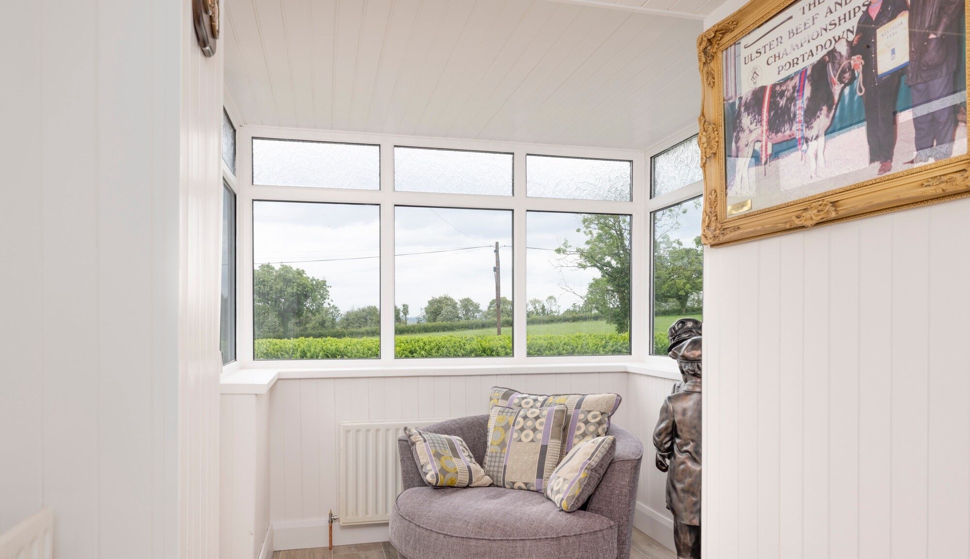 Bright interior with large windows overlooking scenic countryside in Cosbystown, Enniskillen, County.
