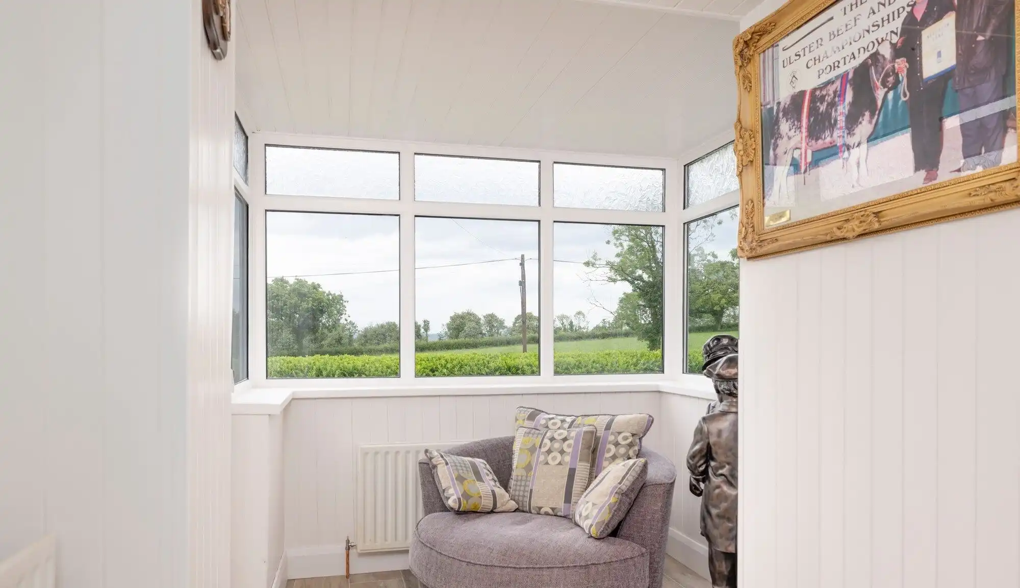 Bright interior with large windows overlooking scenic countryside in Cosbystown, Enniskillen, County.
