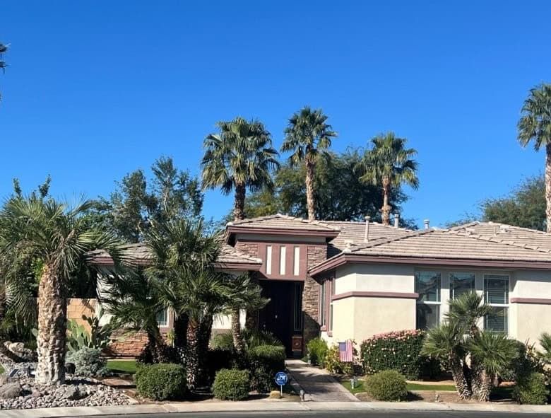Elegant 4-bedroom villa for sale in Generations Indio, California, featuring lush landscaping and mo.