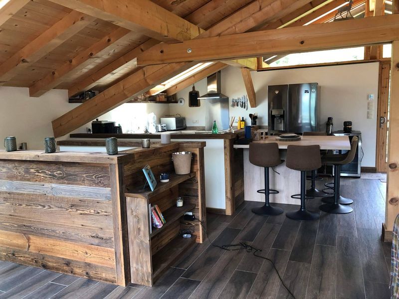 Luxury 5-Bed Chalet Interior Spacious chalet kitchen with modern appliances and rustic wooden accents in Samoens.