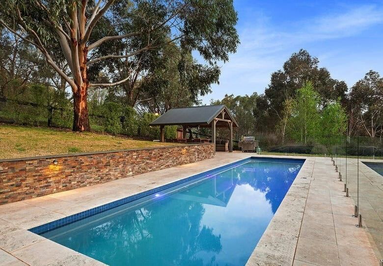 Equestrian estate with pool in Flowerdale Victoria, featuring lush surroundings and spacious outdoor.