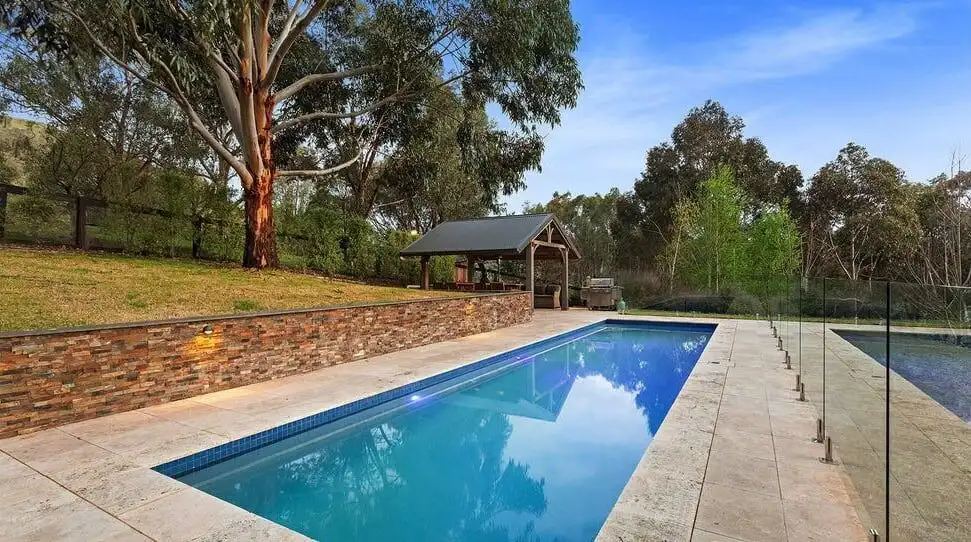 Equestrian estate with pool in Flowerdale Victoria, featuring lush surroundings and spacious outdoor.