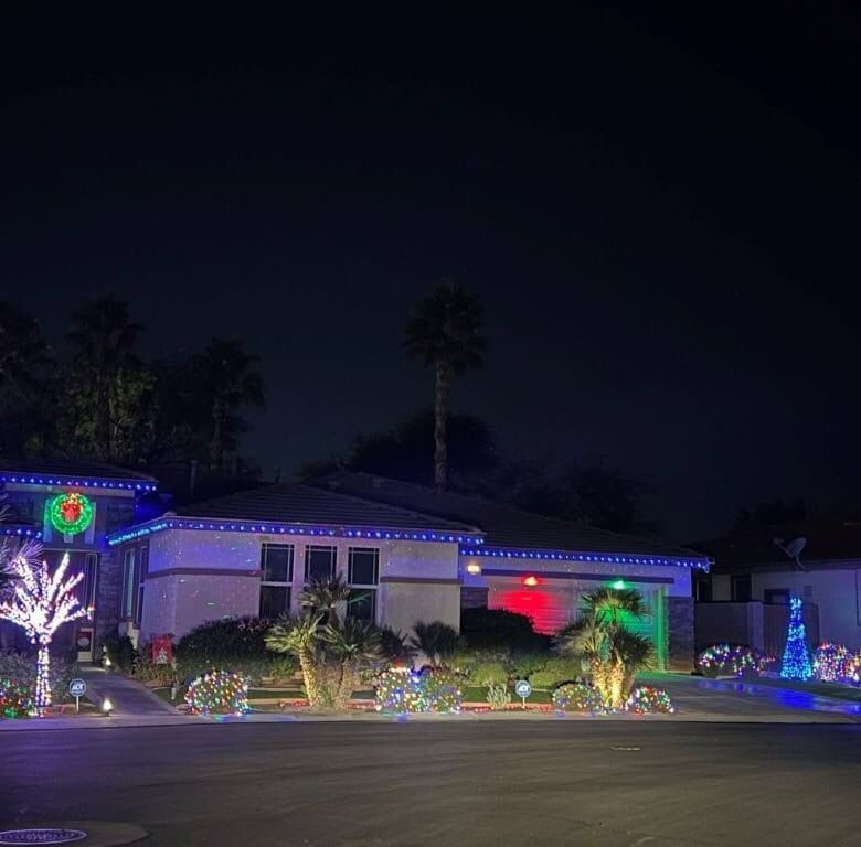 Elegant 4-bedroom villa with festive holiday lighting in Indio, California. Perfect for luxury livin.