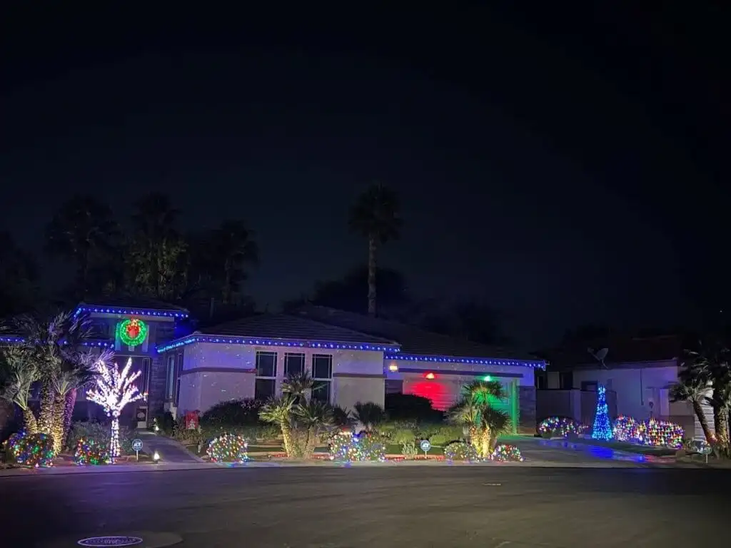 Elegant 4-bedroom villa with festive holiday lighting in Indio, California. Perfect for luxury livin.