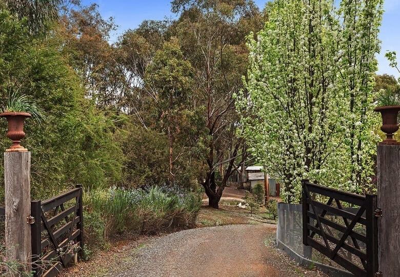Elegant entrance to a luxurious 6-bedroom equestrian estate in Flowerdale, Victoria. Perfect for hor.