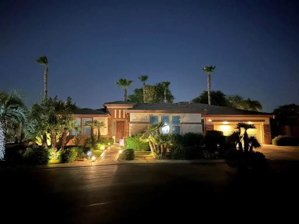 Elegant 4-bedroom villa for sale in Indio, California, featuring modern design and lush landscaping.