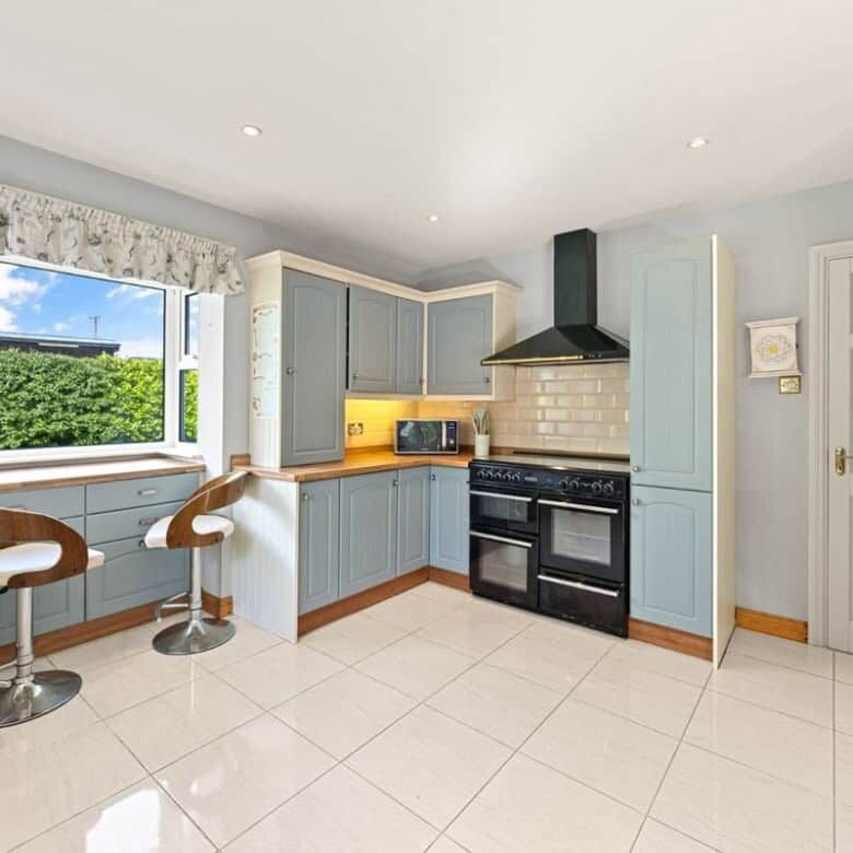 Bright kitchen with large window overlooking greenery in Ballycorrigan, Ballina, Co Tipperary.
