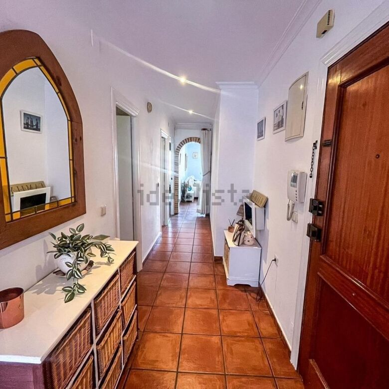 Interior view of a 3-bedroom apartment in Algorfa, Spain, showcasing a bright hallway with wooden ac.