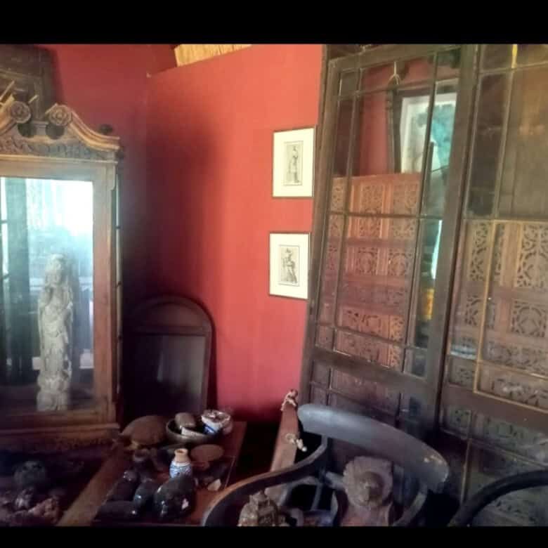 Style interior featuring antique furniture and decorative items.