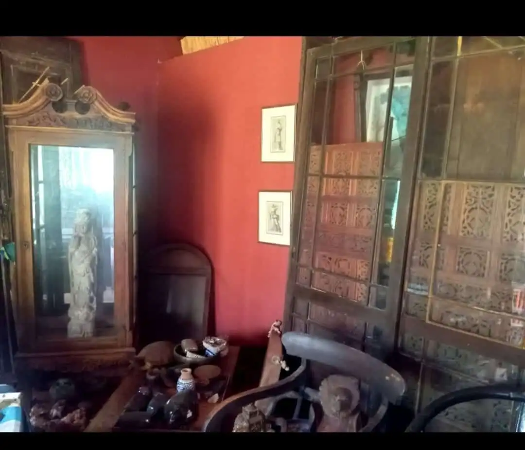 Style interior featuring antique furniture and decorative items.