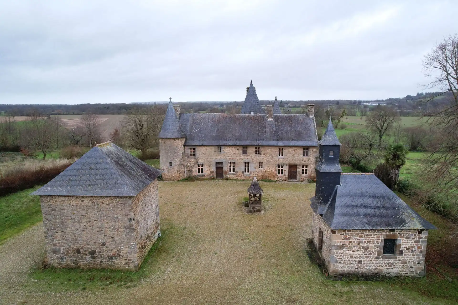 Le Manoir de Dougeru historic castle for sale in Normandy, featuring five bedrooms and scenic countr.