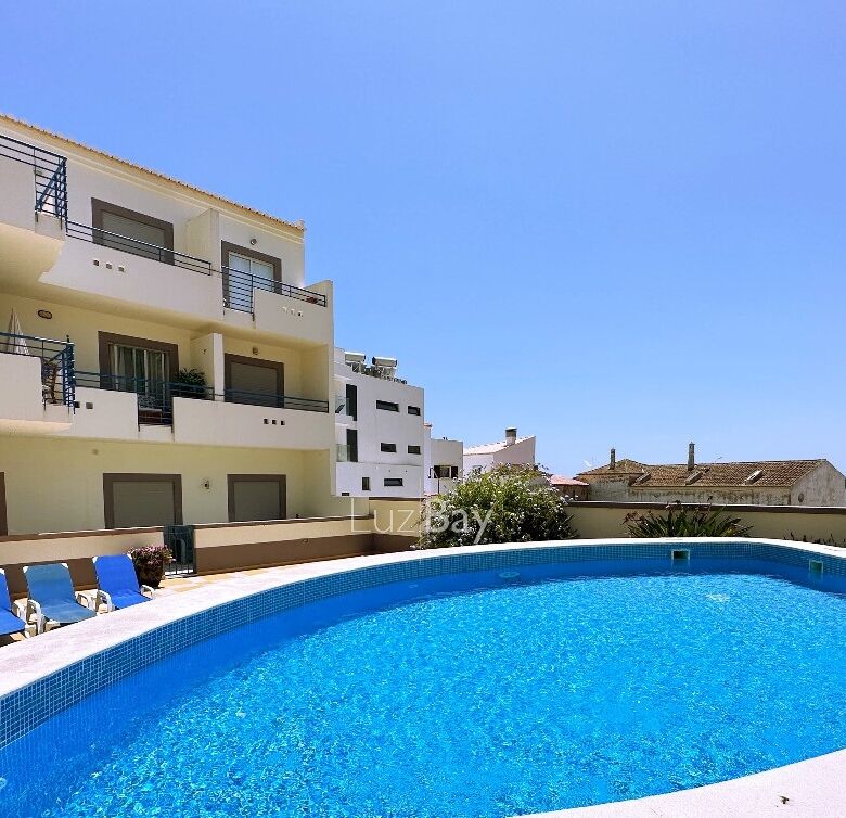 Pool view of a modern apartment in Salema, Algarve, Portugal.