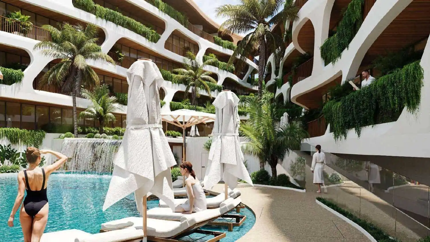 Modern Bali apartment complex with pool and lush greenery.