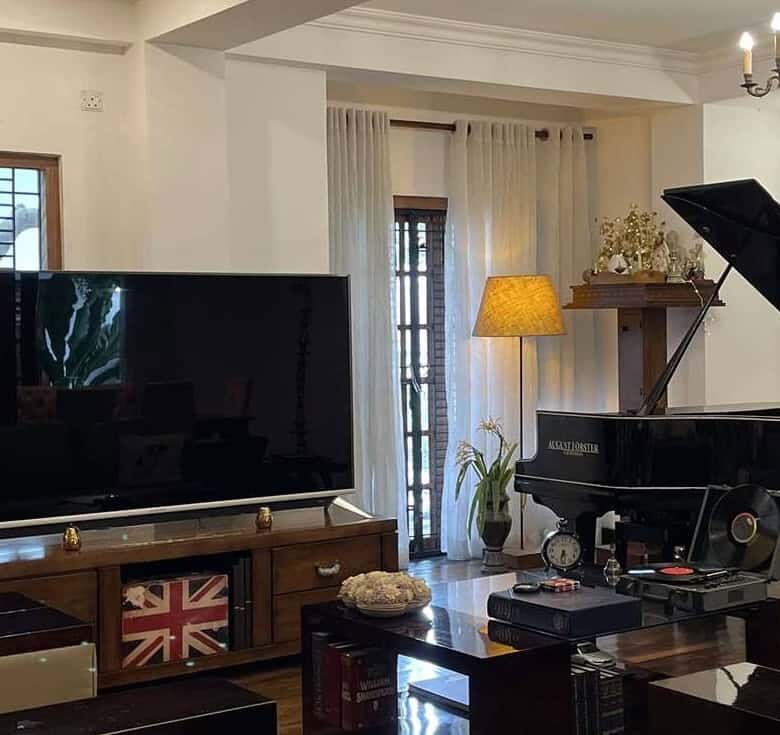 Elegant living room with grand piano and modern decor in Colombo, Sri Lanka.