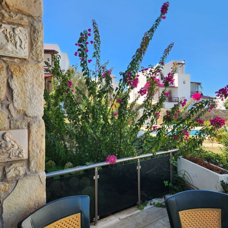 Sea view luxury 3-bedroom villa in Gumusluk, perfect for tranquil living and investment.
