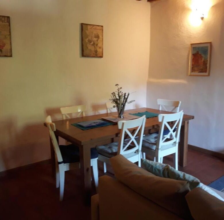 Elegant dining area in a spacious Bagni di Lucca villa with classic decor.